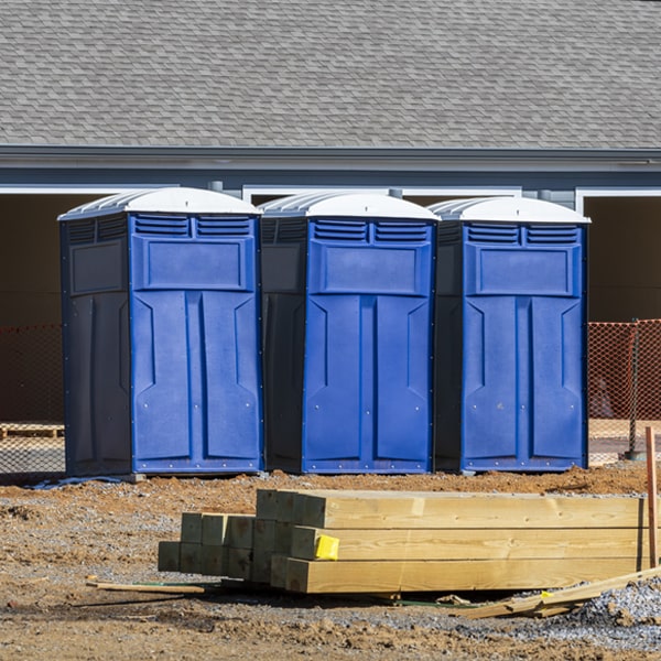 what is the cost difference between standard and deluxe portable toilet rentals in Teec Nos Pos AZ